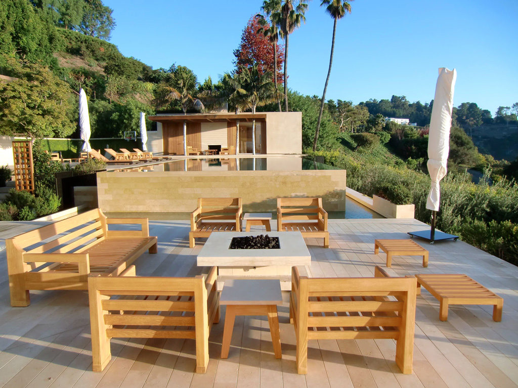 Teak furniture set on a fire pit patio