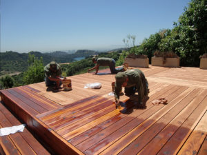 One of Teak Masters' teams working through the process of restoring and protecting a local California Redwood deck.