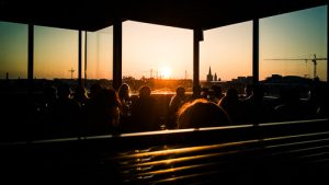 People eating at a restaurant during sunset