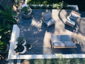 garapa wood furniture sitting on a wooden patio