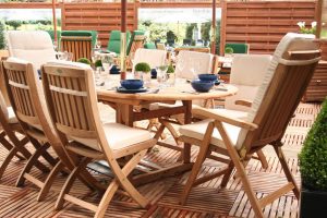 A wooden teak table and chair set