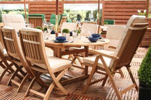 Teak patio set with dishes