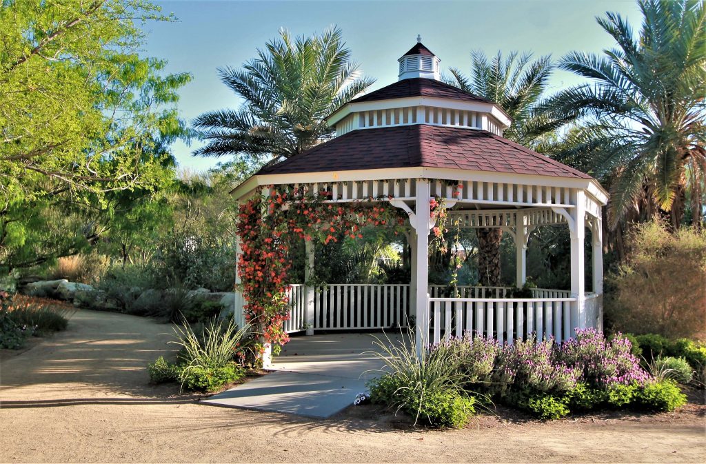 White wooden gazebo in an outdoor space