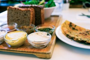 plant based food presented on a plate and serving platter