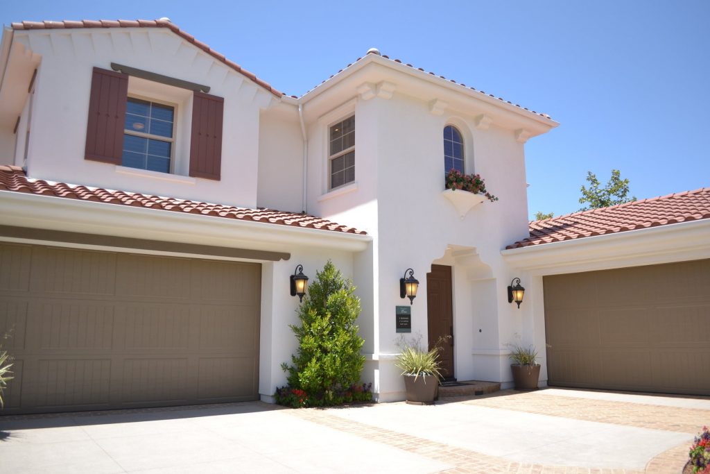 white two story home with two garages