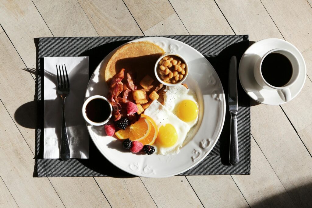 Brunch food served on a plate on a wooden table