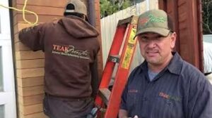 The Teak Master team on the scene of a cedar refinishing project