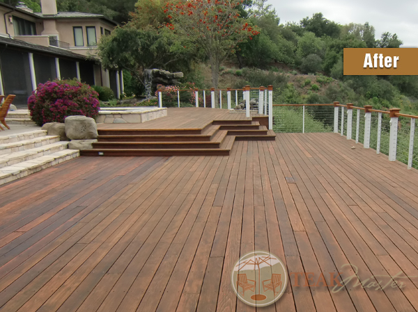 A beautiful dark-red cedar deck in pristine condition attached to a hill-side home after full restoration by Teak Masters.