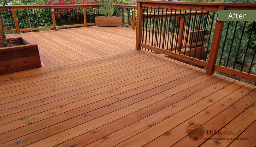 A cozy corner of an elevated California deck overlooking local foliage after Teak Masters has restored the redwood to its former brilliance and natural glow.