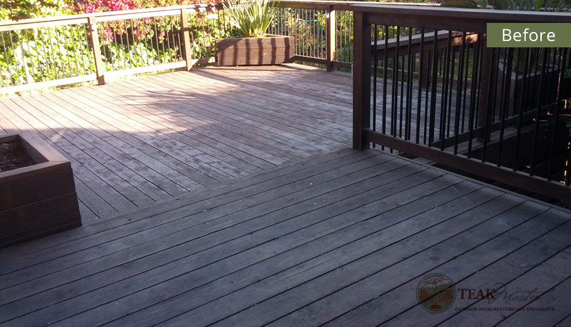 A nice deck that desperately needs either reconditioning or repair to help the natural redwood suffering under foot.