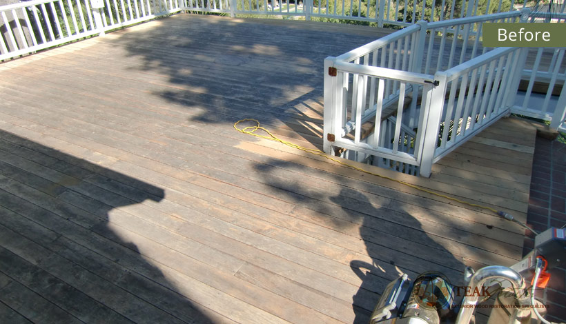 An uninviting, depressing deck badly in need of refinishing.